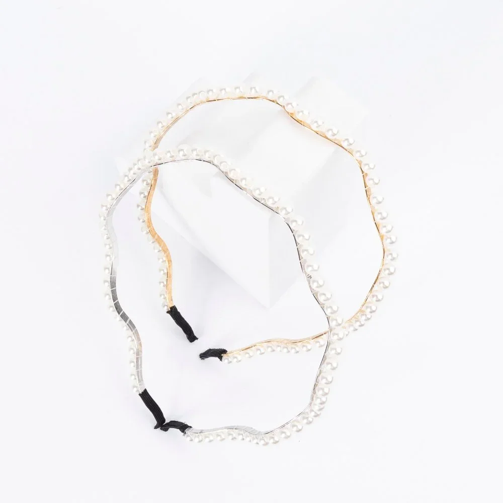 VINCHA CON PERLAS ENROSCADAS